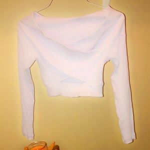 Out from under.  Chest crossed crop top